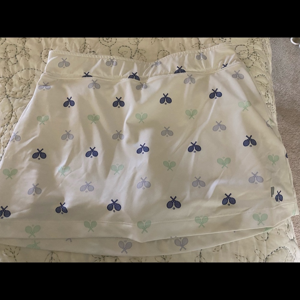 Prince girl’s tennis skirt, white w rackets on it.  Sz L